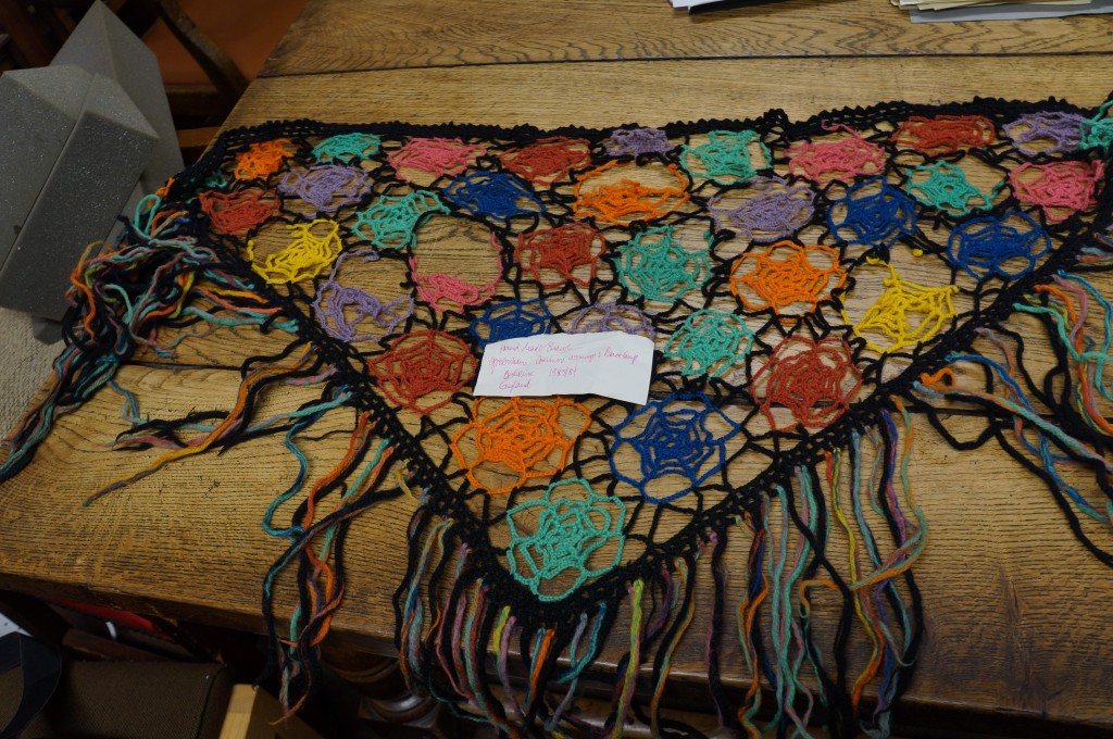 Triangular shawl with different coloured webs sewn together