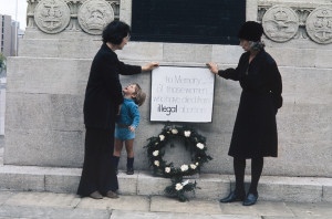 Two women lay a wreath at the war memorial in the centre of Bristol in memory of women who had died from illegal abortions