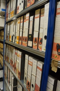 Two shelves of box files